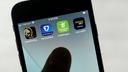 FanDuel, DraftKings, and other online gambling apps are displayed on a phone. FanDuel, DraftKings, and other online gambling apps are displayed on a phone.