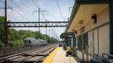 A man sits on a SEPTA platform. A man sits on a SEPTA platform.