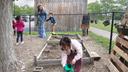 Diana McGuire leads her 4-year-old son Noah by the hand across the playground at St. Mary's Early Childhood Center in Indianapolis, Ind., May 13, 2026. Diana McGuire leads her 4-year-old son Noah by the hand across the playground at St. Mary's Early Childhood Center in Indianapolis, Ind., May 13, 2026.