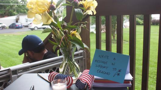 Flowers and a small American flag on a table at a vigil in Muhlenberg Township, where supporters were invited to write messages to Erasmo Zavala. Flowers and a small American flag on a table at a vigil in Muhlenberg Township, where supporters were invited to write messages to Erasmo Zavala.