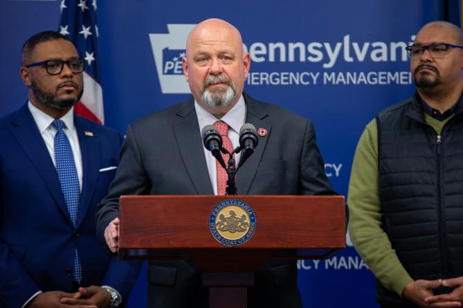 Democratic congressional candidate Bob Brooks stands at a podium. Democratic congressional candidate Bob Brooks stands at a podium.