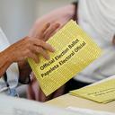 Workers sort mail ballots on primary Election Day 2024 at Northampton County Courthouse in Easton, Pennsylvania.