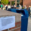 People wait in line outside the Bucks County government building to apply for an on-demand mail ballot on the last day to request one.