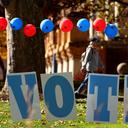 Students on the campus of the University of Pittsburgh walk past a ‘vote’ sign on Election Day, Nov. 5., 2024.