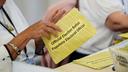 Workers sort mail ballots on primary Election Day 2024 at Northampton County Courthouse in Easton, Pennsylvania.