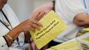 Workers sort mail ballots on primary Election Day 2024 at Northampton County Courthouse in Easton, Pennsylvania.