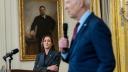 Vice President Kamala Harris looks on as President Joe Biden delivers remarks in the East Room of the White House.