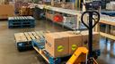 The senior food box assembly line at the Greater Pittsburgh Community Food Bank. Each package receives a package which includes canned fruits, vegetables, and beans, pasta, cereal, juice, and cheese.