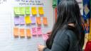 A woman in Berks county puts up a Post It note listing issues critical to her community