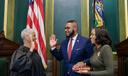 Austin Davis (center) is sworn in as lieutenant governor flanked by his wife Blayre Holmes Davis (right).