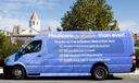 A van advertising changes to Medicare created by the Inflation Reduction Act sits outside the Heinz-Menaker Senior Center in Harrisburg.