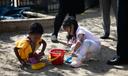 Children at Shady Lane School in Pittsburgh play in a sandbox.