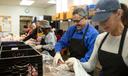 Volunteers prepare meals to deliver to older adults in Montgomery County in 2019.