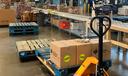 The senior food box assembly line at the Greater Pittsburgh Community Food Bank. Each package receives a package which includes canned fruits, vegetables, and beans, pasta, cereal, juice, and cheese.