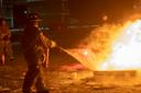 A firefighter puts out a fire during a training class.