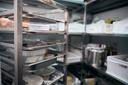 A stock image of a walk-in fridge in a restaurant. A stock image of a walk-in fridge in a restaurant.