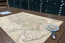 A map of Pennsylvania and a magnifying glass A map of Pennsylvania and a magnifying glass