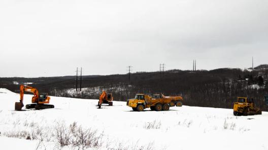 A high-voltage powerline runs behind a construction site in Archbald, PA. A high-voltage powerline runs behind a construction site in Archbald, PA.