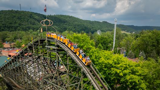 Riders on Knoebels’ Phoenix roller coaster begin their descent. Riders on Knoebels’ Phoenix roller coaster begin their descent.