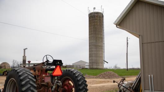 Radios and a microwave dish, installed on top of a farm silo, provide internet service to nearby homes. Radios and a microwave dish, installed on top of a farm silo, provide internet service to nearby homes.
