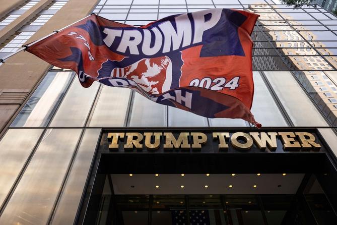 A Trump 2024 flag is raised outside of Trump Tower on July 14, 2024, in New York.