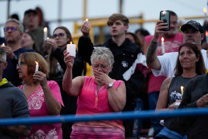 Family, friends and community attend a candlelight vigil for Corey Comperatore at Lernerville Speedway in Sarver, Pennsylvania.