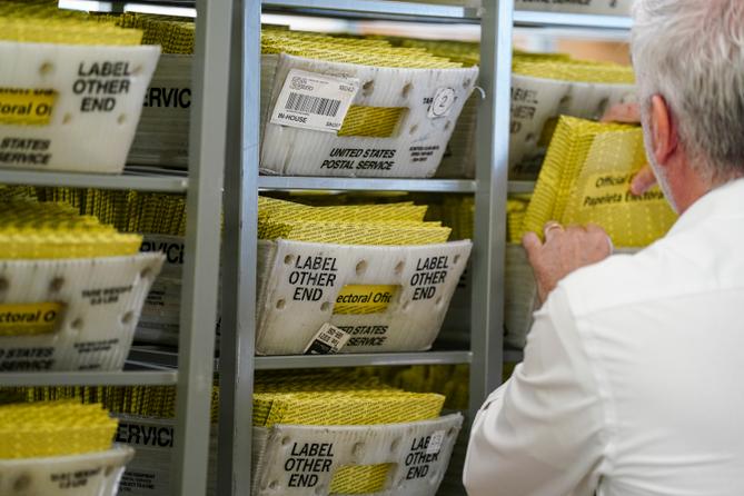 Workers sort mail ballots on Nov. 5, 2024, at Northampton County Courthouse in Easton, Pennsylvania.