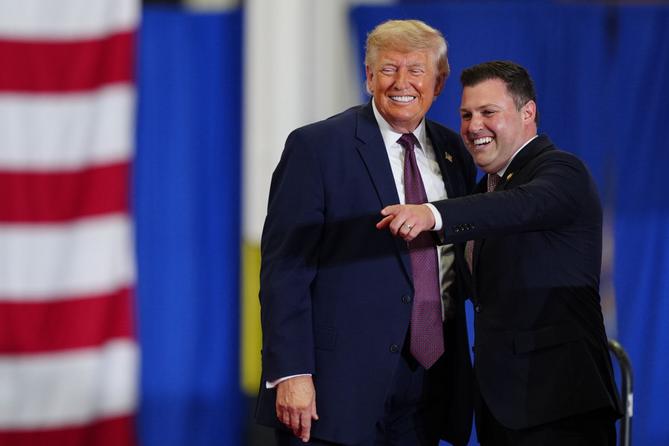 President Donald Trump and Rep. Ryan Mackenzie, R-Pa., right, appear on stage together during an event at a Mack Trucks facility, Tuesday, June 23, 2026, in Macungie, Pa. President Donald Trump and Rep. Ryan Mackenzie, R-Pa., right, appear on stage together during an event at a Mack Trucks facility, Tuesday, June 23, 2026, in Macungie, Pa.