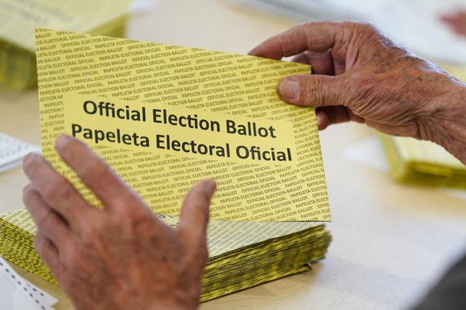 Workers sort mail ballots on primary Election Day 2024 at Northampton County Courthouse in Easton, Pennsylvania.