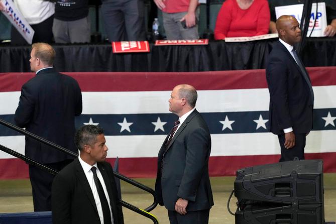 Members of the Secret Service look on as Republican presidential candidate former President Donald Trump speaks at a campaign event, July 20, 2024, in Grand Rapids, Mich.