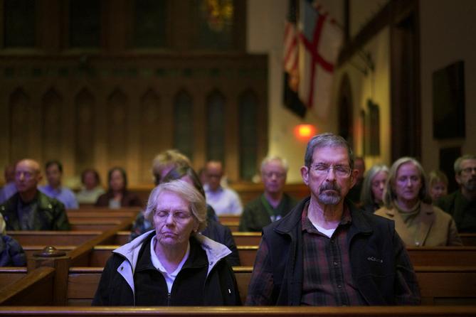 Pat, left, and Joe Weaver sit in meditation during a weekly "Contemplative Citizenship" service at St. James Episcopal Church in Lancaster, PA.