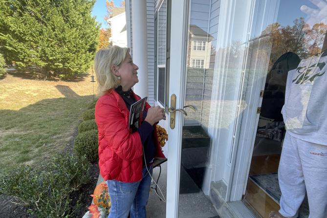 Elizabeth Moro, a state House candidate, knocks on doors in West Chester a week before the Nov. 5 election.