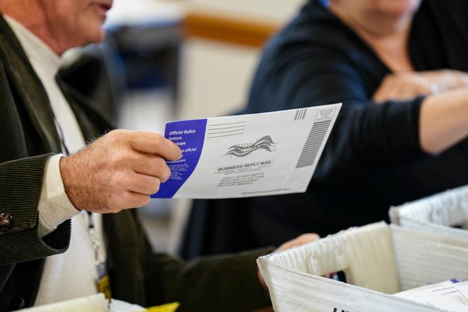 Workers sort mail ballots on Nov. 5, 2024, at Northampton County Courthouse in Easton, Pennsylvania.