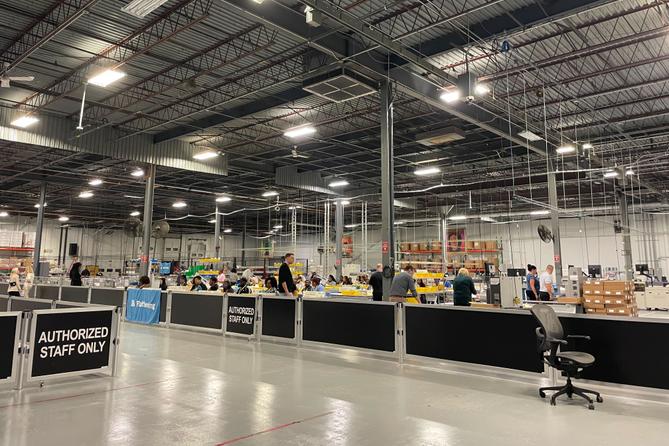 At Philadelphia's ballot counting warehouse, dozens of workers, who do paid eight-hour shifts, are assigned to tasks like sorting, opening, flattening, and scanning ballots.