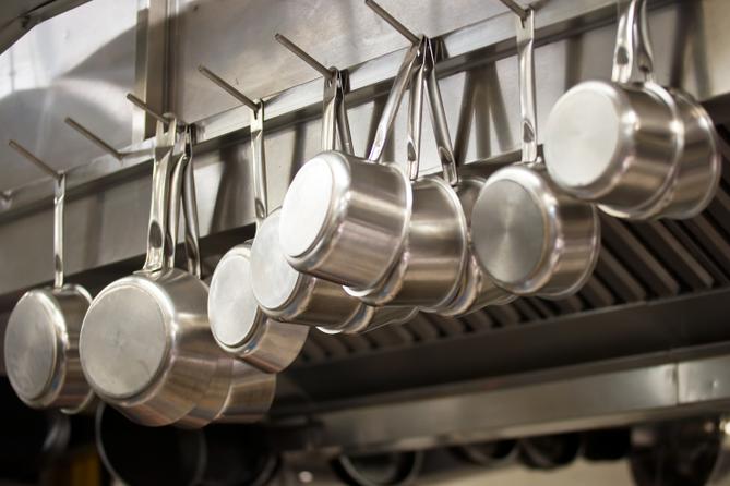 A stock image of pans hanging in a restaurant A stock image of pans hanging in a restaurant