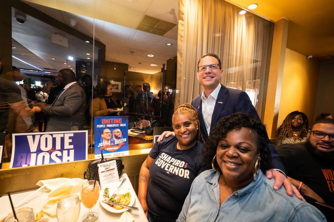 Josh Shapiro (standing) at an Election Day lunch in Philadelphia.
