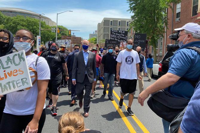Gov. Tom Wolf marches with demonstrators in Harrisburg on June 3, 2020.