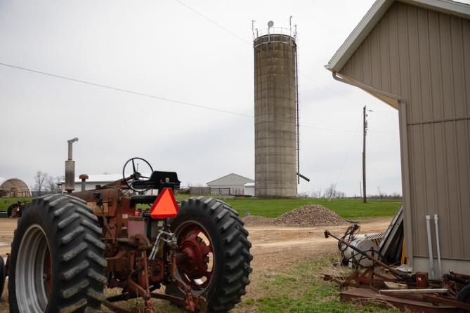 Radios and a microwave dish, installed on top of a farm silo, provide internet service to nearby homes. Radios and a microwave dish, installed on top of a farm silo, provide internet service to nearby homes.