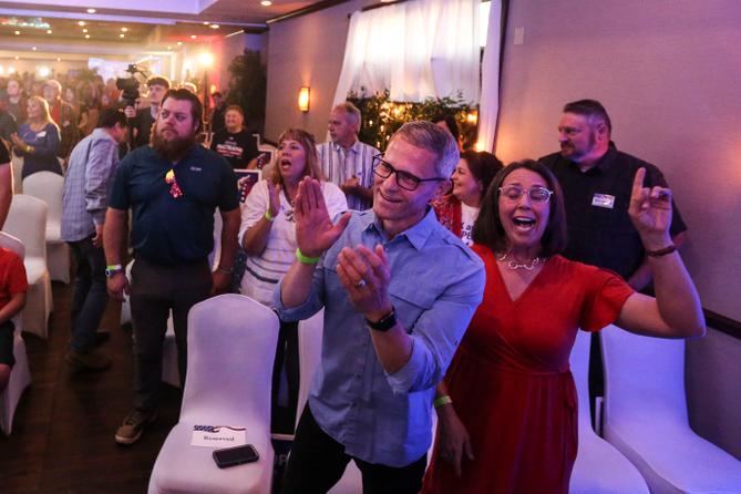 Supporters of Pennsylvania GOP governor candidate Doug Mastriano sing songs of worship before seeing him May 17 at his campaign party in Chambersburg. 