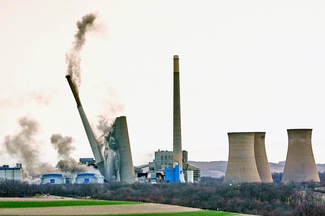 The smokestacks of the former coal-fired Homer City Generating Station crumble in a planned demolition to make way for a new natural gas-fired power plant. The smokestacks of the former coal-fired Homer City Generating Station crumble in a planned demolition to make way for a new natural gas-fired power plant.