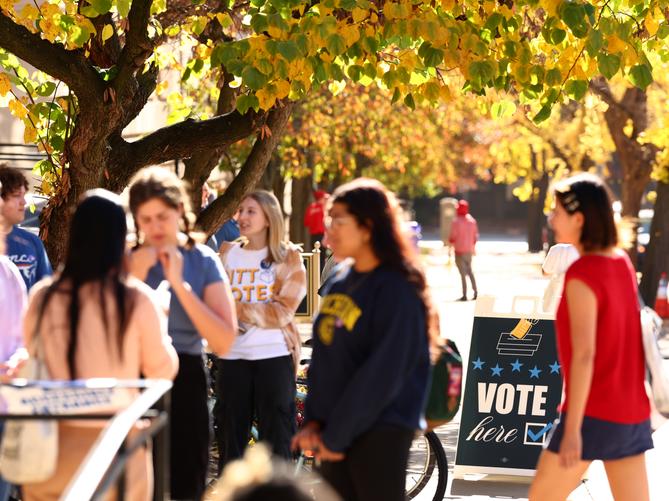 College students from the University of Pittsburgh and Carnegie Mellon University enter the polling station at Bellefield Hall on Nov. 5, 2024.