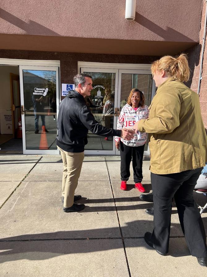 Attorney general candidate Eugene DePasqaule greets voters on Election Day in November 2024.